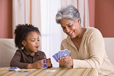 Grandmother and Granddaughter playing cards